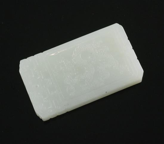 A Chinese pale celadon jade plaque, 5.7cm